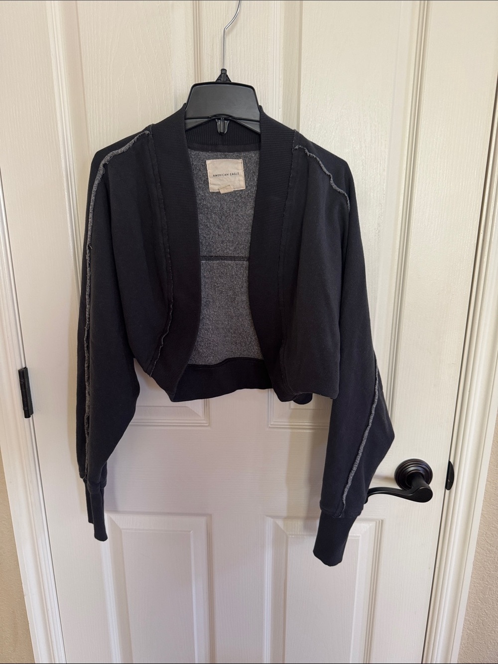 American Eagle shrug. Washed black color size XXS. Great condition!